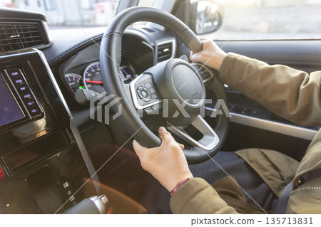 A woman driving a car A woman driving a car 135713831