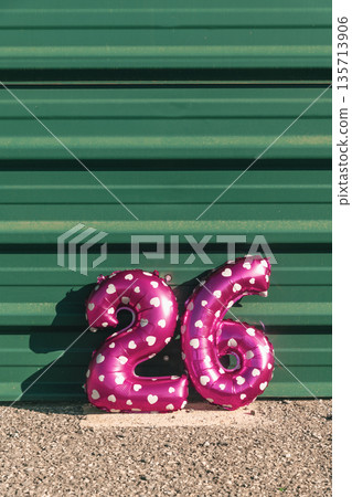 pink balloons forming the number 26 against a wall pink balloons forming the number 26 against a wall 135713906