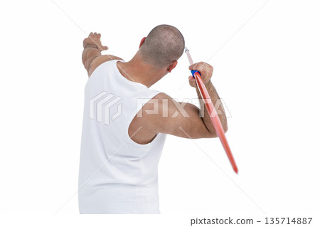 Red-and-white javelin being positioned at shoulder height in seamless white backdrop, copy space Red-and-white javelin being positioned at shoulder height in seamless white backdrop, copy space 135714887