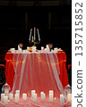 Romantic Red Table Setting with Candles and Champagne for Valentine's Day Dinner Party 135715852