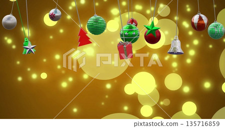 Image of christmas baubles decoration and glowing spots on brown background Image of christmas baubles decoration and glowing spots on brown background 135716859