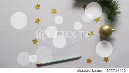 Image of white spots over blank card with christmas decorations on white background Image of white spots over blank card with christmas decorations on white background 135716922