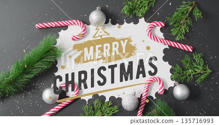 Image of merry christmas text over christmas decorations 135716993