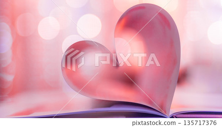 Vintage pink Valentine Day heart made from folded book pages, soft warm bokeh lights, romantic love background, elegant seasonal decoration, dreamy holiday banner 135717376