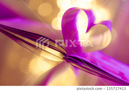 Luxury vertical Valentines Day love concept, purple and gold heart from folded book pages, blurred bokeh lights, romantic artistic background, dreamy holiday inspiration Luxury vertical Valentines Day love concept, purple and gold heart from folded book pages, blurred bokeh lights, romantic artistic background, dreamy holiday inspiration 135717413