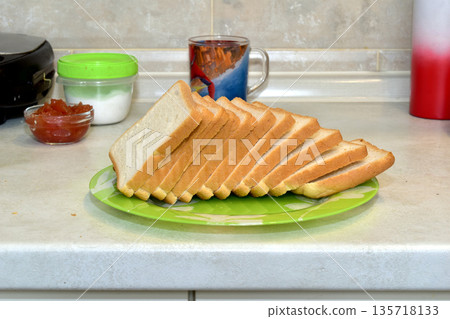 Toast bread is ready to be cooked. Toast bread is ready to be cooked. 135718133
