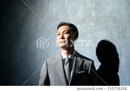 Black background and businessman in suit Black background and businessman in suit 135718268