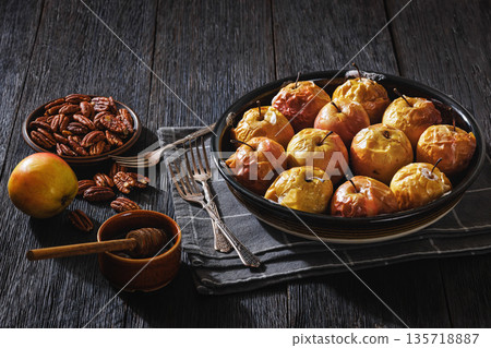 Tasty Baked Apples with Pecans and Honey 135718887