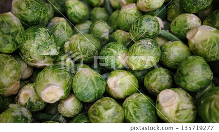 Closeup of frozen Brussels sprout cabbage, healthy green vegetable food texture. Closeup of frozen Brussels sprout cabbage, healthy green vegetable food texture. 135719277