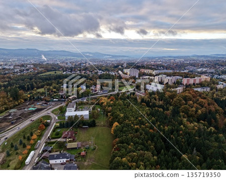 overhead autumnal cityscape view, highaltitude scene of fall neighborhood beneath industrial skyline overhead autumnal cityscape view, highaltitude scene of fall neighborhood beneath industrial skyline 135719350