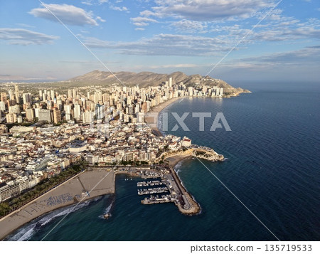 harbor scene with boats and skyline, aerial view of busy harbor with yachts and urban skyline harbor scene with boats and skyline, aerial view of busy harbor with yachts and urban skyline 135719533