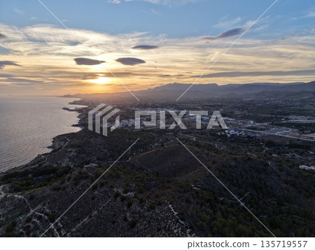 vivid coastal aerial imagery, remote coastline captured with dramatic lighting and striking contrast vivid coastal aerial imagery, remote coastline captured with dramatic lighting and striking contrast 135719557