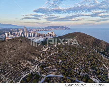 coastal development overview, urban and rural landscape mapping, dawn scene showing city and coast 135719560