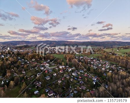 springtime suburban landscape overview, scenic drone shot of fall neighborhood with hills in background springtime suburban landscape overview, scenic drone shot of fall neighborhood with hills in background 135719579