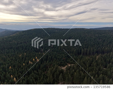 serene mountain view at dusk, silent wilderness landscape under twilight with distant hill silhouettes serene mountain view at dusk, silent wilderness landscape under twilight with distant hill silhouettes 135719586
