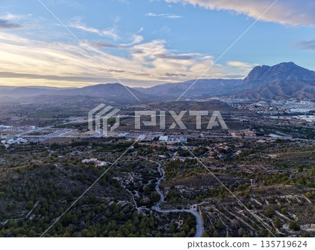 early morning scene showcasing gentle lighting over valley with scattered settlements and mistshrouded ridges 135719624