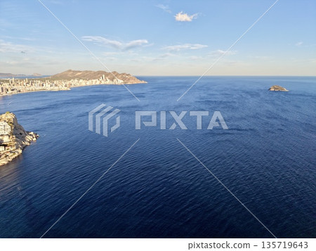 vast waters with calm surroundings, peaceful maritime panorama showcasing distant coastlines and serenity 135719643