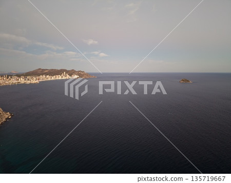 scenic seaside settlement, charming seaside community nestled on cliff with peaceful bay views scenic seaside settlement, charming seaside community nestled on cliff with peaceful bay views 135719667