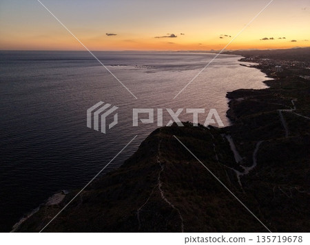 serene coastal scene, serene evening seascape with warm hues inspiring relaxation and romantic ambiance 135719678