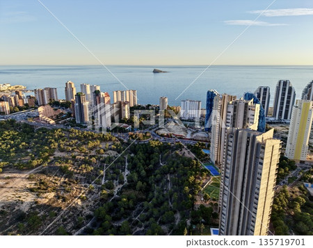 cityscape with natural contrast, aerial perspective showcasing city development and countryside 135719701