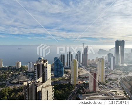 cityscape with maritime backdrop, vibrant city skyline featuring commercial growth and seaside scenery 135719714