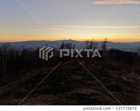 twilight scene with rugged terrain, sunset silhouette amidst rolling hills and glowing skyline twilight scene with rugged terrain, sunset silhouette amidst rolling hills and glowing skyline 135719878