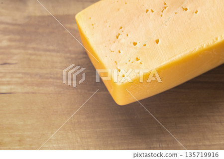 piece of cheese close-up piece of cheese close-up 135719916