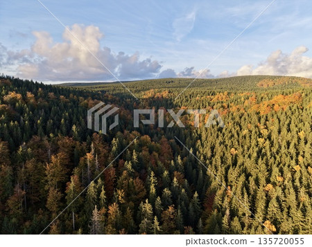 vivid landscape imagery, shadowed slopes contrasted with illuminated ridges in detailed landscape 135720055