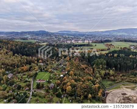 agricultural and woodland valley area, extensive valley featuring fields and forest regions agricultural and woodland valley area, extensive valley featuring fields and forest regions 135720079