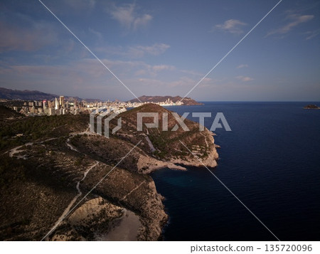 aerial shot of cliffs with sunset scenery, drone captures rocky coast during peaceful dusk hours aerial shot of cliffs with sunset scenery, drone captures rocky coast during peaceful dusk hours 135720096