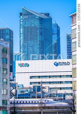 New views of Tokyo's urban landscape in Japan. Views of Toranomon Hills, the Shinkansen bullet train running through Shinbashi, Towa Food Service, etc. (January 23rd) 135720330