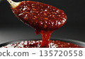 Thick Red Sauce Pouring from Spoon Cooking Detail 4k ai 135720558