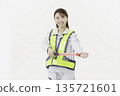 A young Japanese woman wearing work clothes with a safety belt and holding an emergency exit sign on a white background 135721601