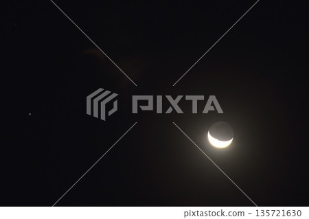 half moon and saturn star floating over cloud on dark sky in night half moon and saturn star floating over cloud on dark sky in night 135721630
