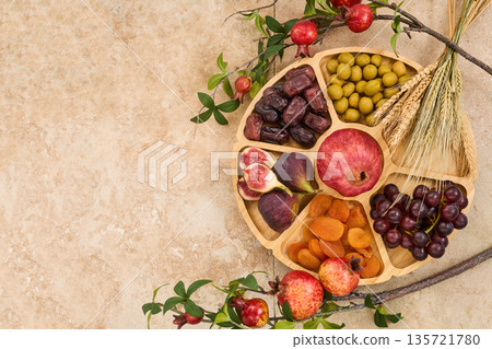 Tu bishvat seder plate with seven species fruits Tu bishvat seder plate with seven species fruits 135721780