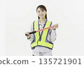 A young Japanese woman wearing work clothes with a safety belt and holding an emergency exit sign on a white background 135721901