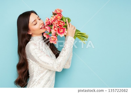 Happy beauty woman with pink tulip bouquet 135722082