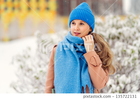 Portrait of a woman on a winter background Portrait of a woman on a winter background 135722131