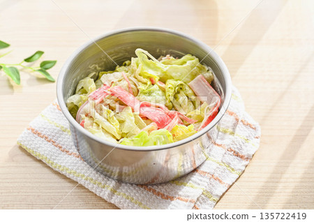 Lettuce and crab sticks with mayonnaise 135722419