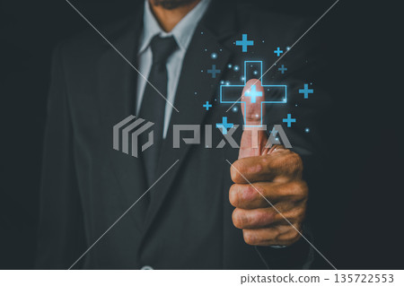 Businessman Giving Thumbs Up with Digital Health Icons in a Dark Suit, Symbolizing Success and Innovation in Healthcare Technology 135722553