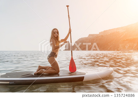 Woman Paddleboarding Ocean, Paddle Board, Beach. 135724886