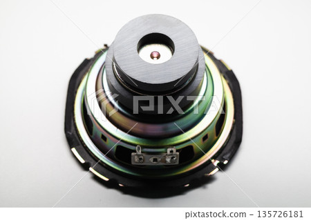 Macro shot of a vibrant speaker component with a magnet Macro shot of a vibrant speaker component with a magnet 135726181