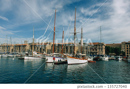 Traditional sailboats docked Traditional sailboats docked 135727040