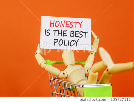 Honesty is the best policy symbol. Concept words Honesty is the best policy on beautiful white paper. Beautiful orange background. Business honesty is the best policy concept. Copy space. Honesty is the best policy symbol. Concept words Honesty is the best policy on beautiful white paper. Beautiful orange background. Business honesty is the best policy concept. Copy space. 135727111