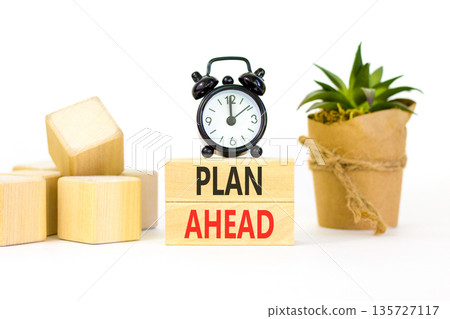 Plan ahead symbol. Concept word Plan ahead on beautiful wooden blocks. Beautiful white paper background. Beautiful black alarm clock. Business plan ahead concept. Copy space. Plan ahead symbol. Concept word Plan ahead on beautiful wooden blocks. Beautiful white paper background. Beautiful black alarm clock. Business plan ahead concept. Copy space. 135727117
