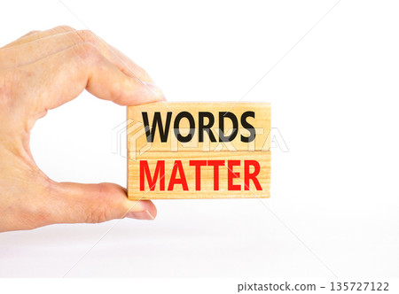 Words matter symbol. Concept word Words matter on beautiful wooden blocks. Beautiful white paper background. Businessman's hand. Business words matter concept. Copy space. 135727122