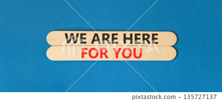 Support, help and we are here for you symbol. Concept words We are here for you on beautiful wooden sticks. Beautiful blue background. Business we are here for you concept. Copy space. Support, help and we are here for you symbol. Concept words We are here for you on beautiful wooden sticks. Beautiful blue background. Business we are here for you concept. Copy space. 135727137