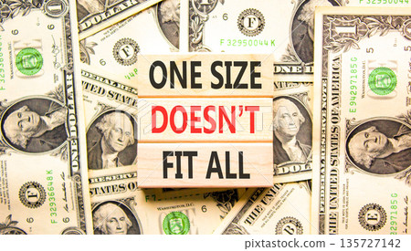One size does not fit all symbol. Concept words One size does not fit all on beautiful wooden blocks. Beautiful dollar bills background. Business one size does not fit all concept. Copy space. 135727142