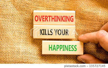 Overthinking kills your happiness symbol. Concept words Overthinking kills your happiness on wooden blocks. Beautiful canvas background. Business overthinking kills happiness concept. Copy space. Overthinking kills your happiness symbol. Concept words Overthinking kills your happiness on wooden blocks. Beautiful canvas background. Business overthinking kills happiness concept. Copy space. 135727145