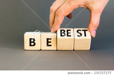Motivational and inspirational be best symbol. Concept words Be best on beautiful wooden block. Beautiful grey background Businessman hand. Business motivational be best concept. Copy space. Motivational and inspirational be best symbol. Concept words Be best on beautiful wooden block. Beautiful grey background Businessman hand. Business motivational be best concept. Copy space. 135727177